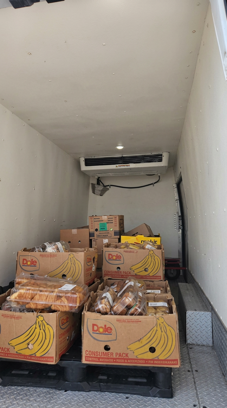 Refrigerated cargo area loaded with boxed produce